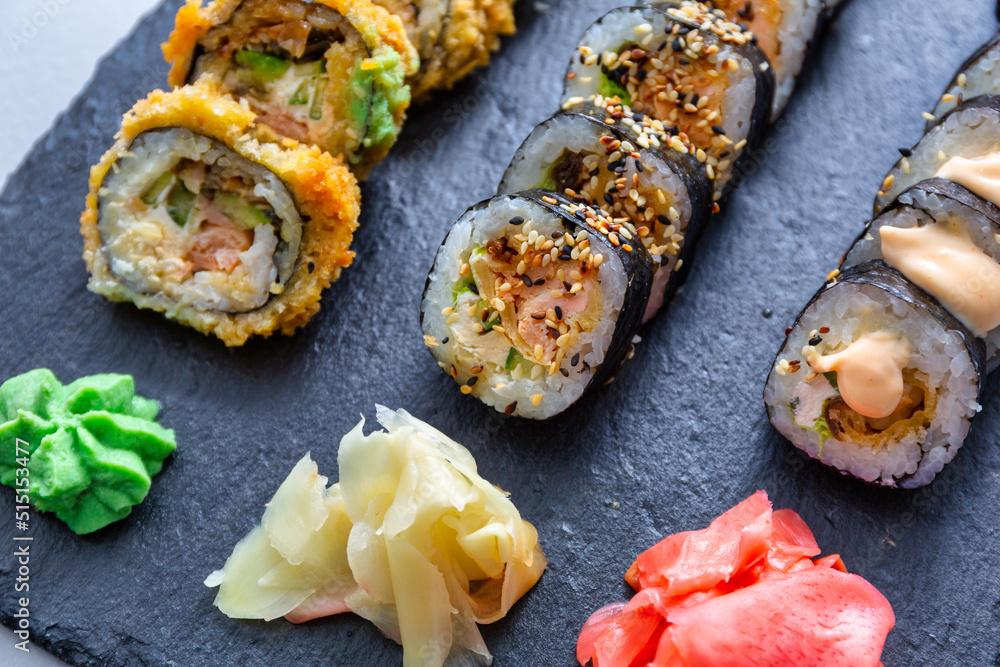 Sushi set grilled in tempura on the stone plate Sushi set grilled in tempura on the stone plate