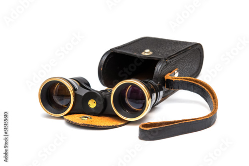 Vintage binoculars with leather case isolated on white background
