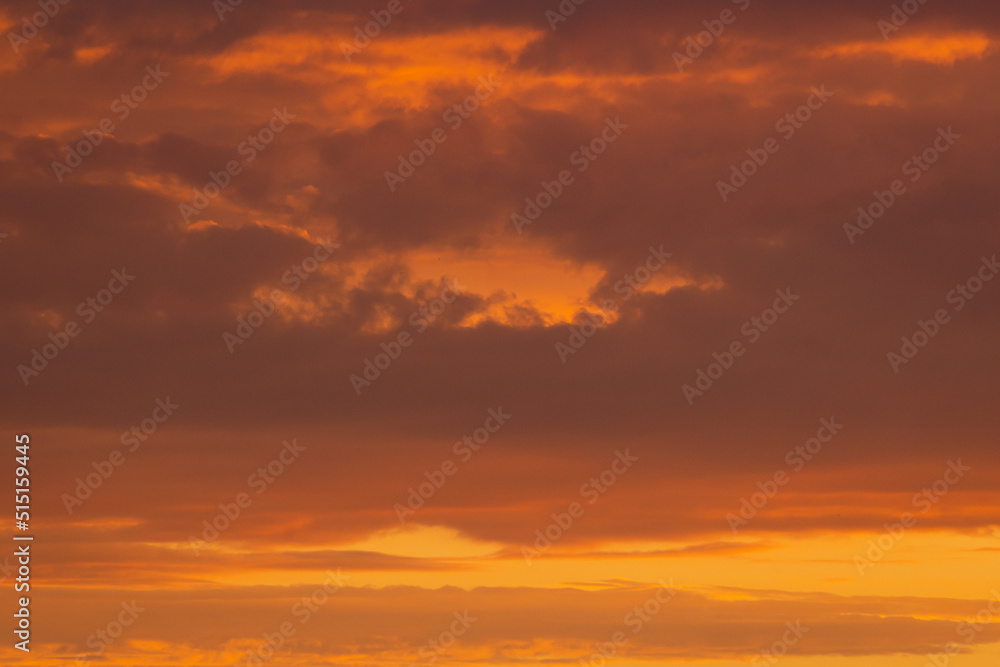 Colorful clouds of various shades on sunrise sky. Abstract and dramatic clouds background. Colorful clouds of various shades on sunrise sky. Abstract and dramatic clouds background.