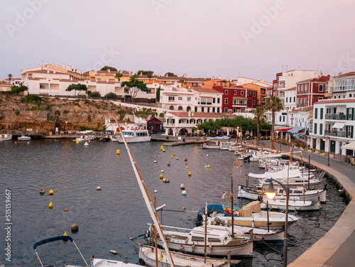 Boats moored in the small port of Cales Fonts in Es Catell, Menorca. photo