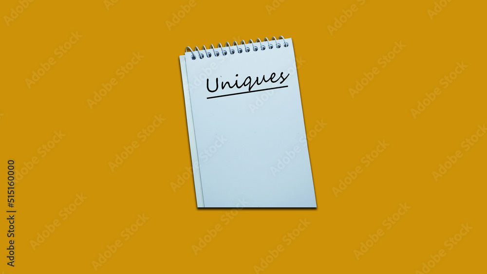 Hand writing note uniques on a notebook. lifestyle, advice, support motivational positive words are written on a wooden background. Business, signs, symbols, concepts. Copy space. Hand writing note uniques on a notebook. lifestyle, advice, support motivational positive words are written on a wooden background. Business, signs, symbols, concepts. Copy space.