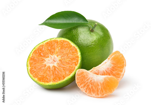 Tangerine orange with cut in half isolated on white background. Clipping path. © Paitoon
