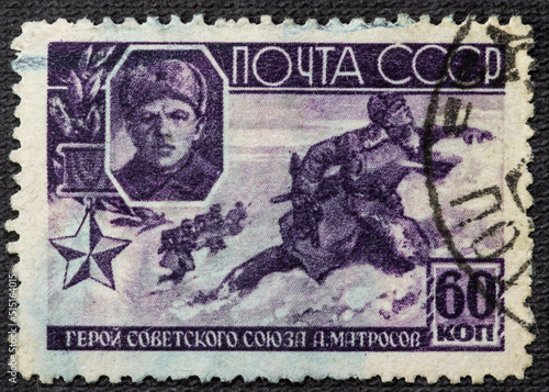 USSR - CIRCA 1944: A postage stamp printed in the USSR shows a military battle. Title: Hero of the Soviet Union A. Matrosov. The Second World War. Around 1944 photo