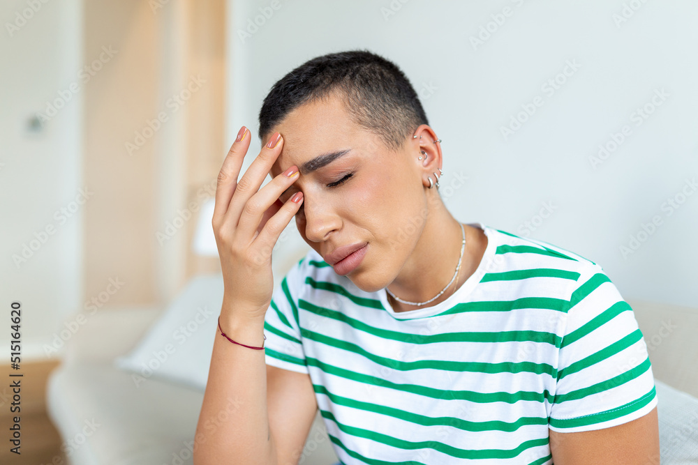 Sinus ache causing very paintful headache. Unhealthy woman in pain. Sharp strong sore. Sinus pain, sinus pressure, sinusitis. Sad woman holding her head because sinus pain Sinus ache causing very paintful headache. Unhealthy woman in pain. Sharp strong sore. Sinus pain, sinus pressure, sinusitis. Sad woman holding her head because sinus pain