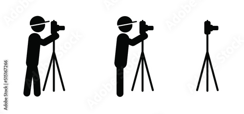 Cartoon stickman, stick figure man looks through the photo camera. Three legged cameras. Photography shooting pictogram. Photographer pictogram tools icon or symbol. For tourism, travel and holiday.