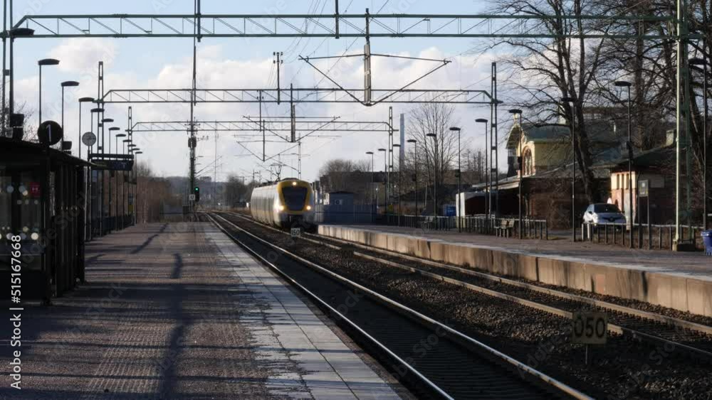 Train Arrives at Empty Platform in Small Town in Sweden, Slow Motion Train Arrives at Empty Platform in Small Town in Sweden, Slow Motion