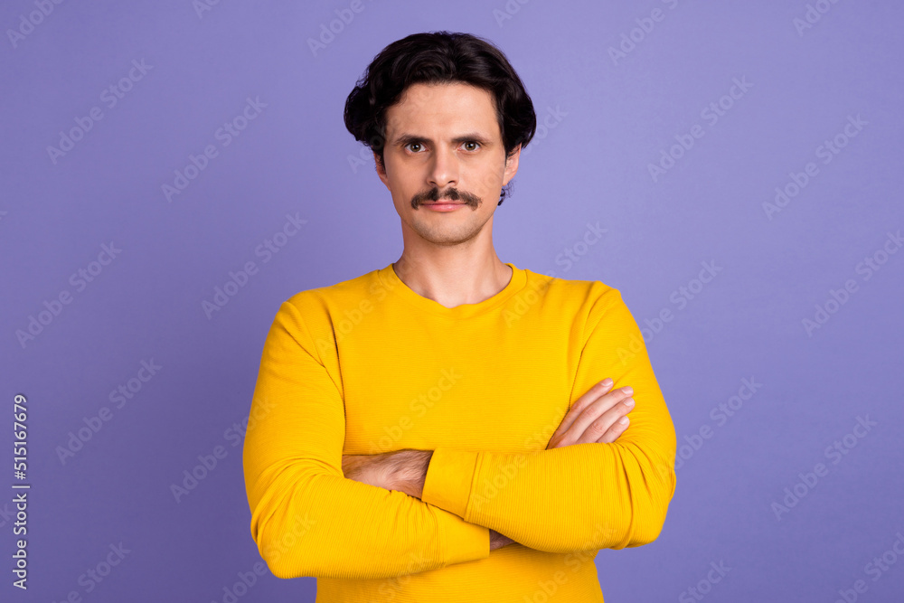 Portrait of calm young person crossed arms look camera isolated on pastel purple color background Portrait of calm young person crossed arms look camera isolated on pastel purple color background