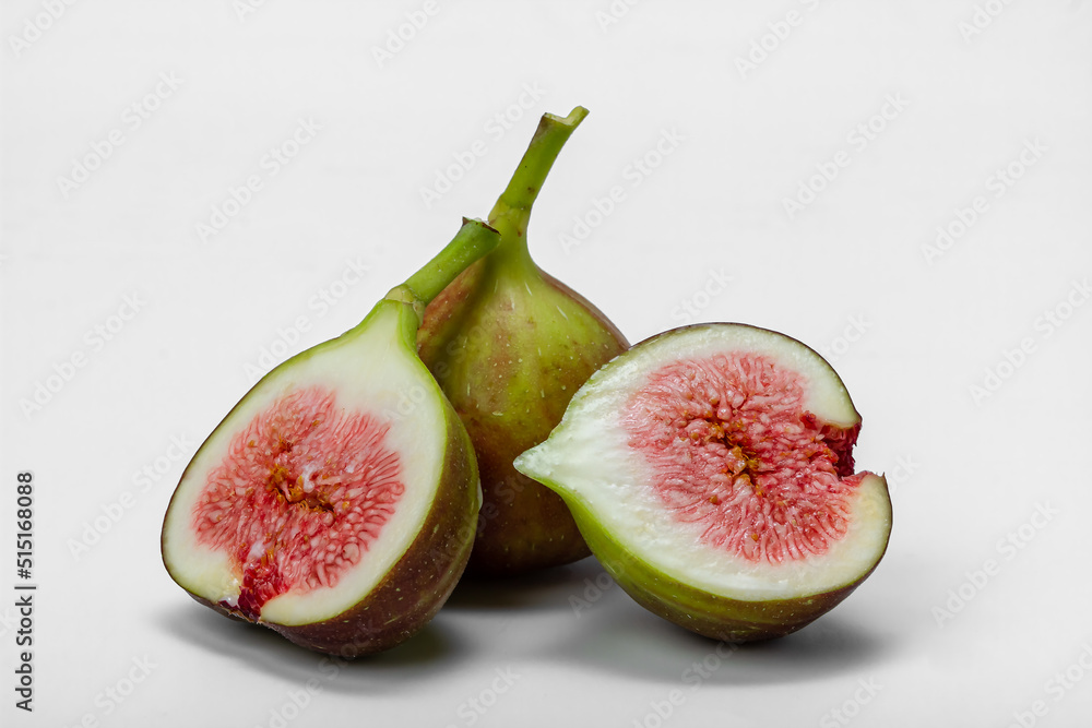 Fresh fig fruits isolated on white background. Food photo. Fresh fig fruits isolated on white background. Food photo.
