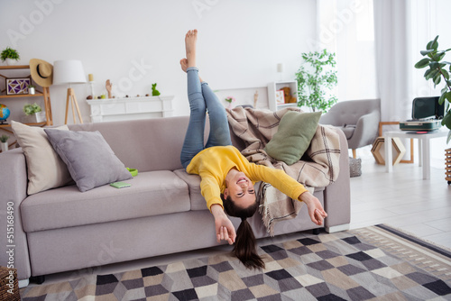 Εκτύπωση καμβά Full body portrait of satisfied glad person laying upside down sofa toothy smile