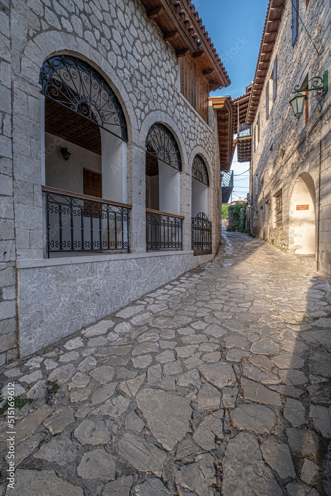 Street view in Dimitsana, a picturesque mountain village, built like am amphitheatre, surrounded by mountain tops, Arcadia, Peloponnes, Greece.