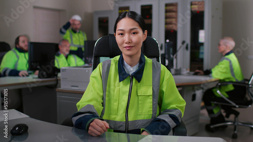 Portrait of asian woman engineer in uniform having video conference working in office