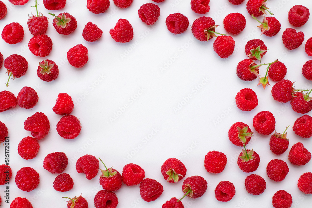 Ripe juicy fresh raspberries on white background flat lay top view. Raspberry pattern. Organic raspberries, healthy food, vitamins, summer berry fruit background. Raspberry harvest