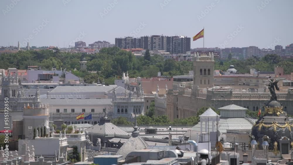 Flag of Spain and the European Union on top of Bank of Spain and Town Hall in Madrid architecture landmarks buildings. 4k video. Flag of Spain and the European Union on top of Bank of Spain and Town Hall in Madrid architecture landmarks buildings. 4k video.