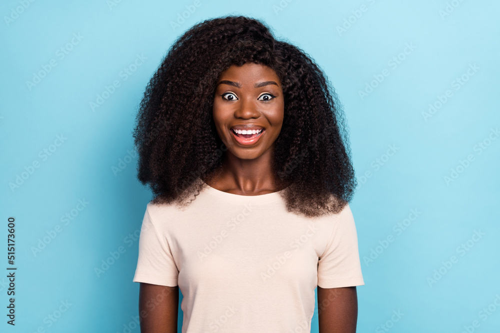 Fototapeta premium Photo of astonished positive girl cant believe unbelievable news isolated on blue color background