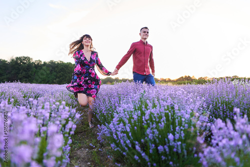 Young couple in a lavender field at sunset