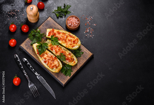 Baked stuffed zucchini boats with minced chicken mushrooms and vegetables with cheese