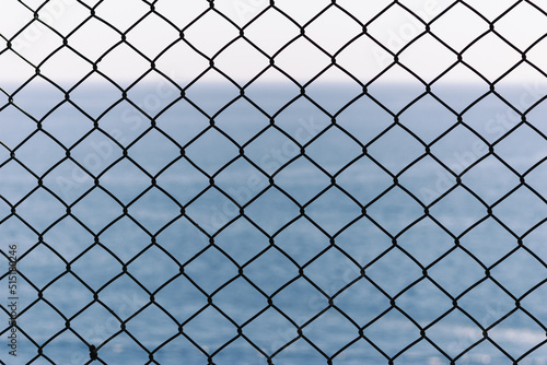 chain link fence with sky