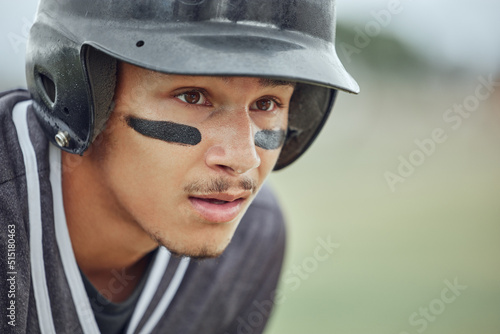 Photography Closeup of baseball player looking focused with warrior paint on his face