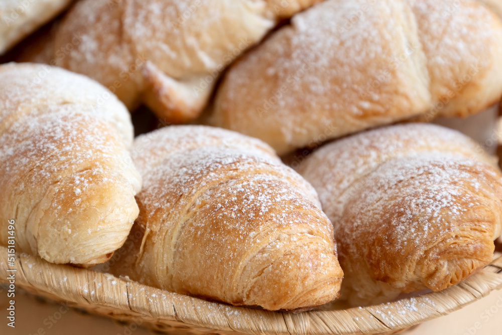Close up butter croissants sprinkled with powdered sugar, Homemade pastry