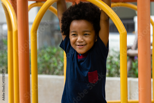 African kid smiling while playing at playground