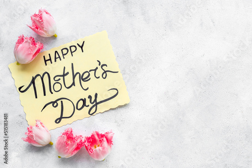 Happy Mothers day background with pink flowers, top view