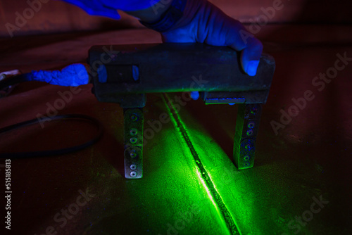 Steel plate tank butt weld carbon background green contrast of magnetic field fluorescence