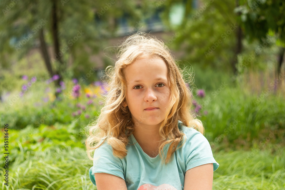 Portrait of a little cheerful girl in a T-shirt. Portrait of a little cheerful girl in a T-shirt.