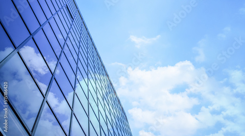 Windows of modern business building office concept with skyscraper for work with the perspective background cloud in the sky