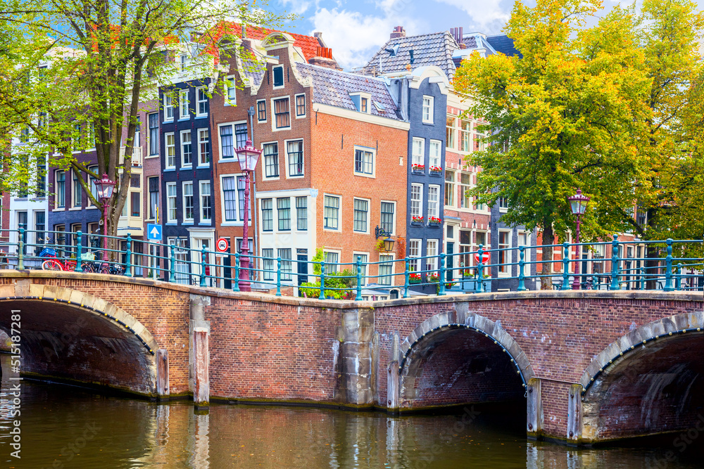 The famous sloping houses of Amsterdam. Nice view with canals and bridges. Downtown of Amsterdam. Amsterdam, Holland, Netherlands,