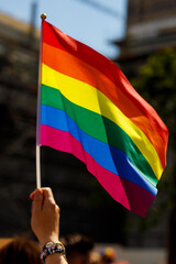 Lgbt pride rainbow flag during parade in the city .