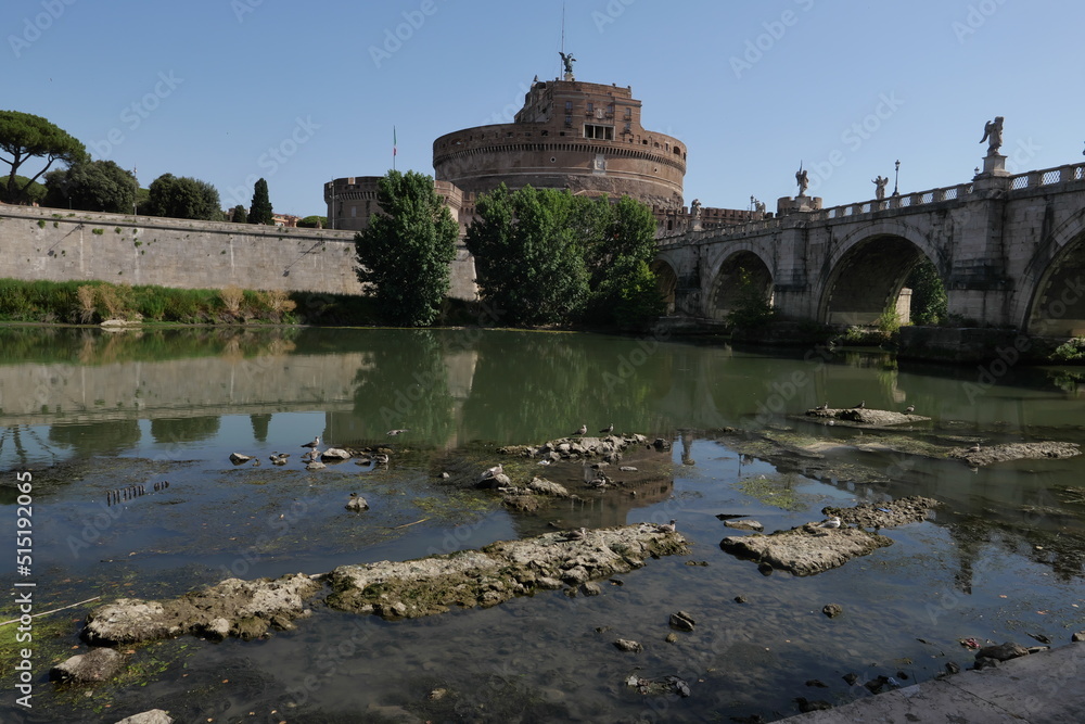 ROME JULY 5 32022 A VIEW OF THE TIBER RIVER NEVER SO LOW DUE TO DROUGHT. REMAINS OF AN ANCIENT COLLAPSED ROMAN BRIDGE EMERGED