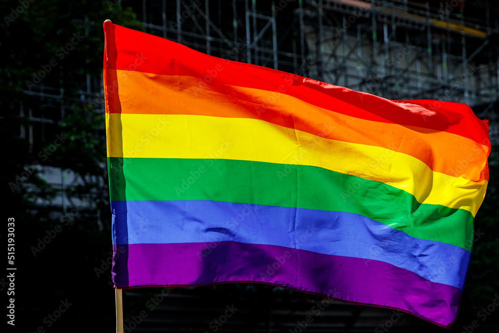 Obraz premium Lgbt pride rainbow flag during parade in the city .