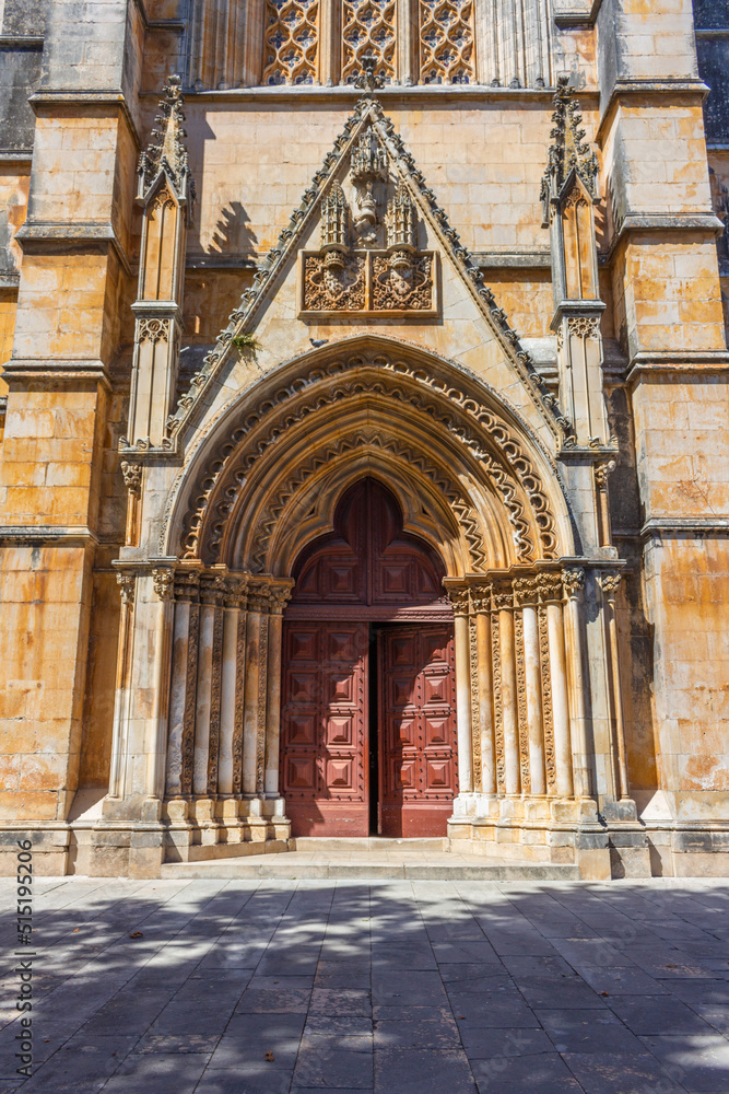 Batalha, Portugal - August 21, 2021: The Transept Portal of the Batalha Monastery. Portugal. UNESCO World Heritage Site.