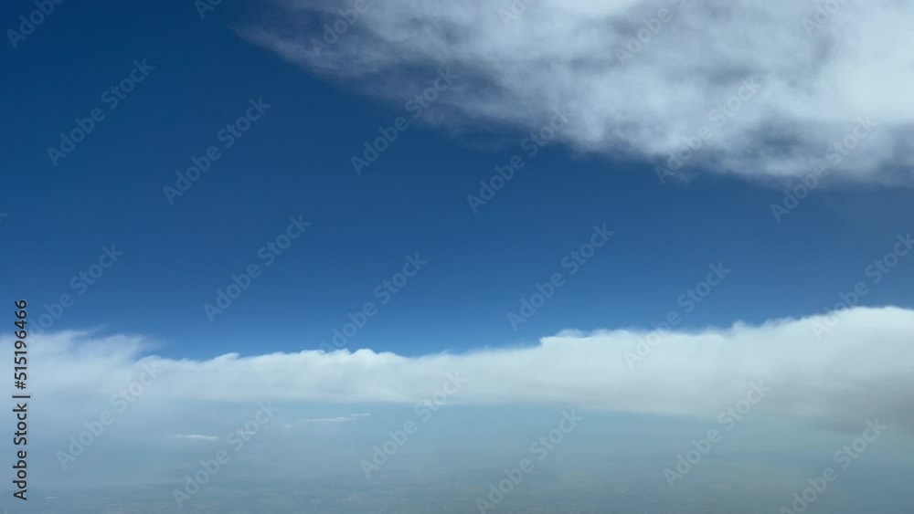 Unique pilot point of view while flying through a blue summer sky and avoiding some fluffy clouds. Daylight.4k Unique pilot point of view while flying through a blue summer sky and avoiding some fluffy clouds. Daylight.4k