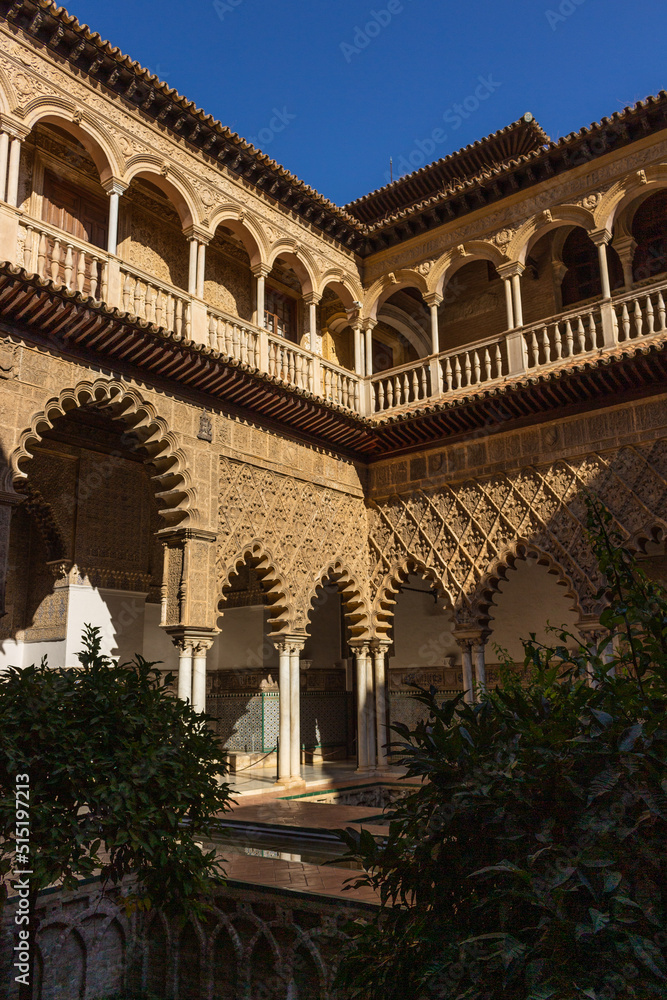 Seville, Spain, September 12, 2021: The Royal Palace of Seville (Real Alcazar). The Maidens Courtyard. The Mudejar of Pedro I on the ground floor and the Renaissance of the first monarchs.