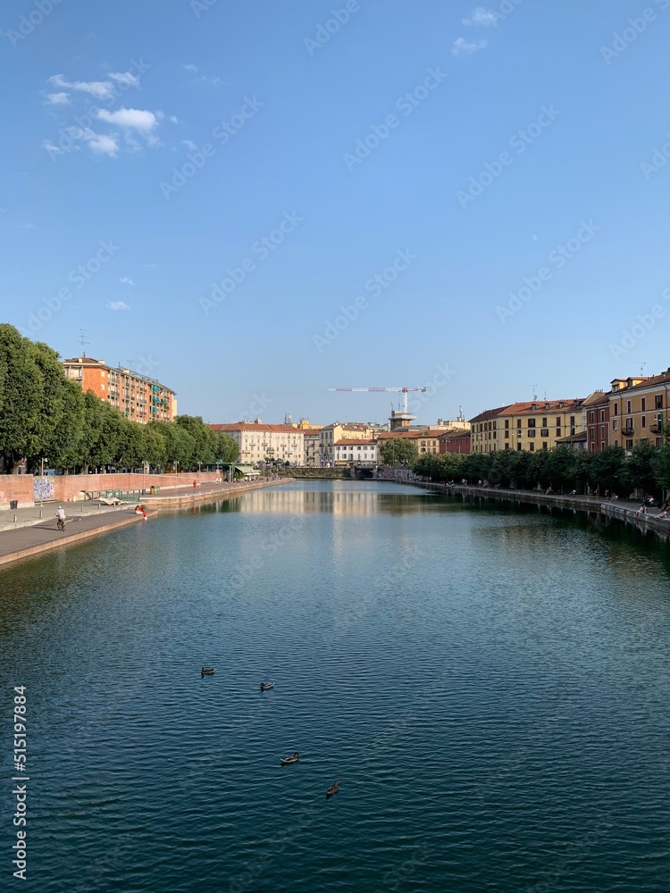 The beginning of Naviglio Grande (Darsena) canal. It is a famous local people recreation and tourists attraction place.  Park and waterfront. Milan, Lombardy, Italy