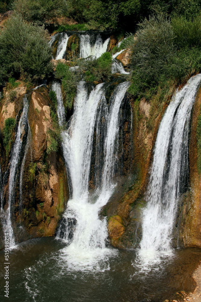 Vertical part of Muradiye Selalesi Waterfall, which flows down from the rocky mountains, near the city of Van, in the region of Eastern Anatolia, Turkey