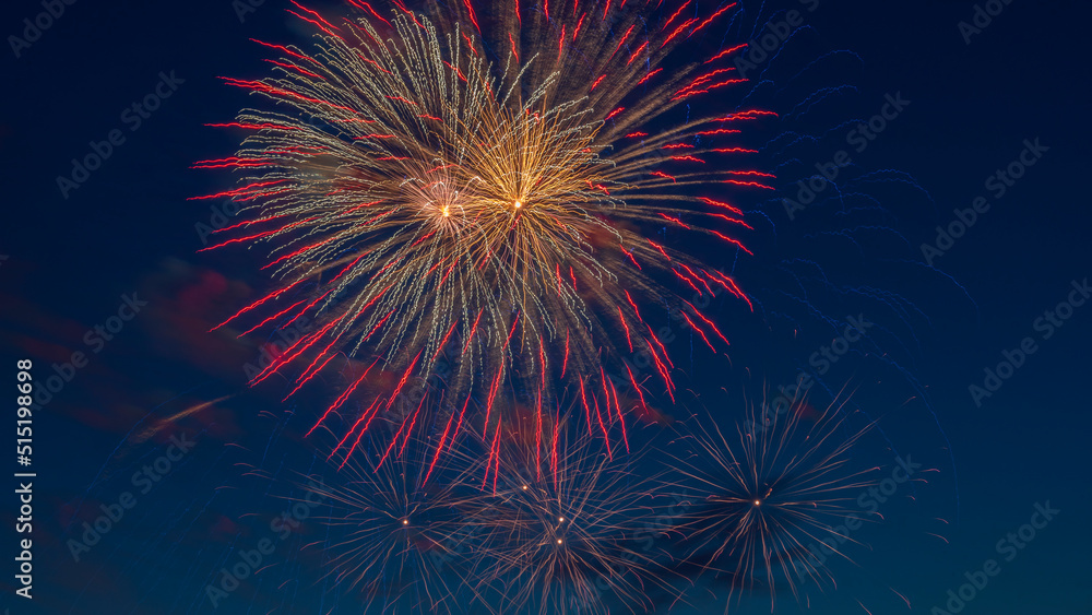 Fireworks light up the sky with dazzling display. Abstract colored firework background with free space for text. Fireworks light up the sky with dazzling display. Abstract colored firework background with free space for text.