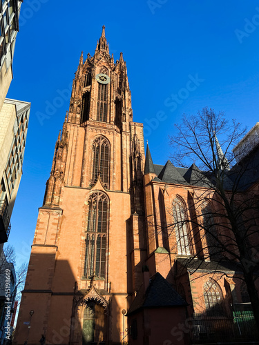 Frankfurt am Main, Germany, December 7, 2021: SLOW SHOT The tower of Frankfurt's Saint Bartholomeus's Cathedral (Kaiserdom St. Bartholomaus), a Roman Catholic Gothic church located in the city center. photo