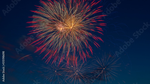 Fireworks light up the sky with dazzling display. Abstract colored firework background with free space for text.