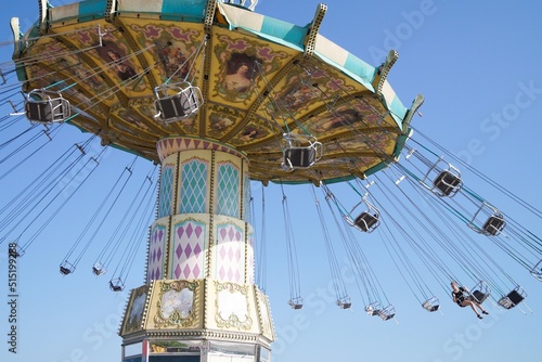 Volgograd, Russian Federation, June 19, 2022 - Swing carousel in an amusement park on the Volga River embankment.  photo