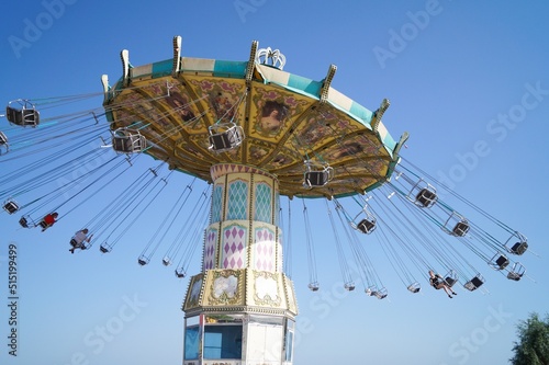 Volgograd, Russian Federation, June 19, 2022 - Swing carousel in an amusement park on the Volga River embankment. 