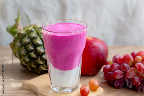colorful healthy fresh fruit smoothy with assorted ingredients serve in glass.