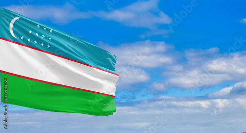 The flag of Uzbekistan (Uzbek: Oʻzbekiston davlat bayrogʻi) consists of three horizontal azure, white and green bands separated by two thin red fimbriations, with a crescent moon and twelve stars photo