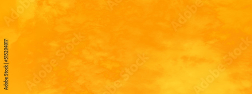 Abstract soft colorful orange background with clouds, yellow and orange burning overcast clouds cape sky with tiny clouds, beautiful orange background for any design and wallpaper.