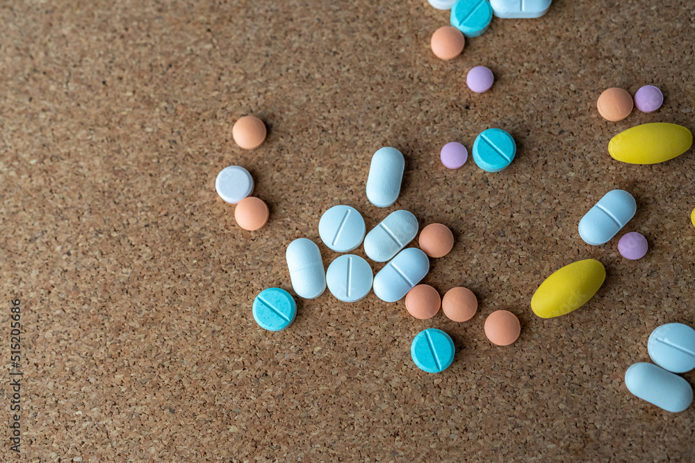 Pharmaceutical medicine pills in both tablets and capsules with the vintage retro picture style. Pharmacy theme and treatment medication as concept. Pharmaceutical medicine pills in both tablets and capsules with the vintage retro picture style. Pharmacy theme and treatment medication as concept.
