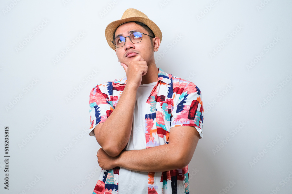 Young handsome man thinking worried about a question, concerned and nervous with hand on chin