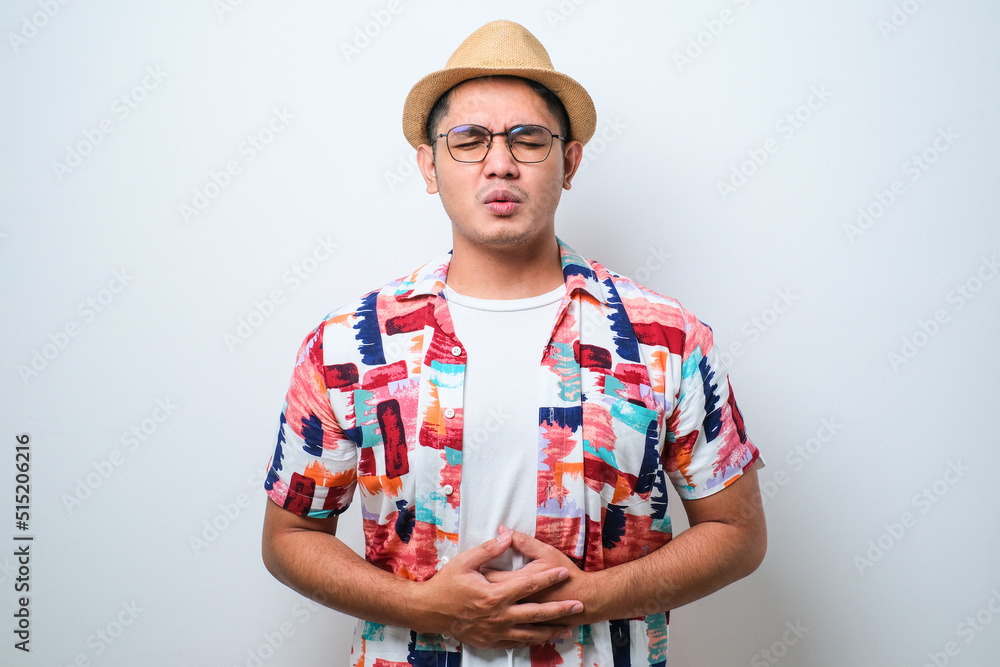 Young handsome Asian man diarrhea health problems hold his belly Young handsome Asian man diarrhea health problems hold his belly
