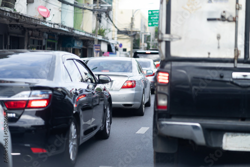 A large number of cars on the road in heavy traffic causes a lot of pollution