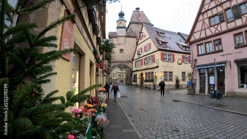 Rothenburg ob der Tauber, Germany, December 8, 2021: The Marcus Tower and the Roder Arch. Markus Tower is situated nearby to Röderbogen, and close to Büttelhaus.